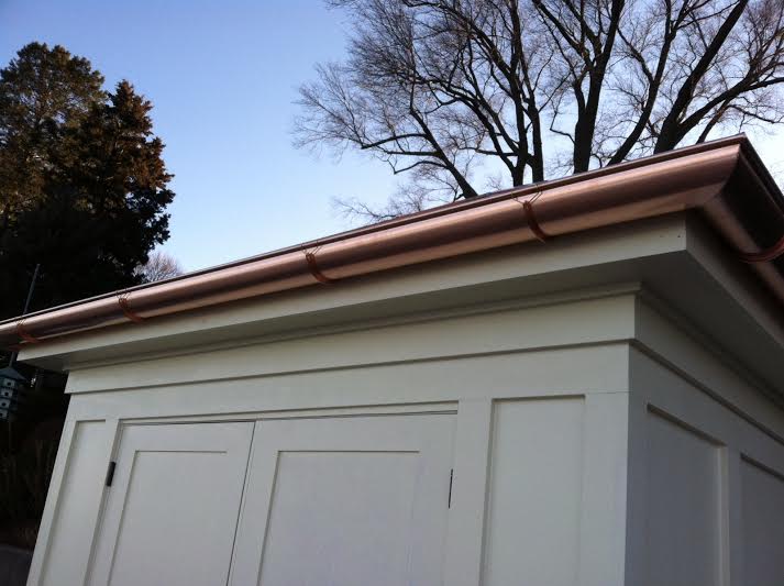 Custom copper roofing detail fabricated and installed on a residence